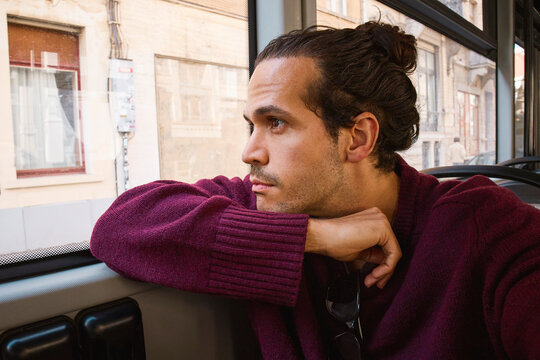 Thoughtful Man on Train Journey