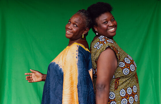 Mother and daughter looking at the camera with smiles