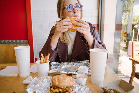 Woman eating burger 