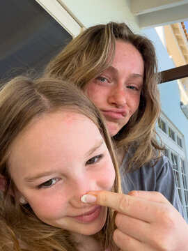 Teenager Sister goofy portrait looking at camera selfie UGC nose 