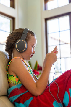 Young girl cell phone video streaming Headphones