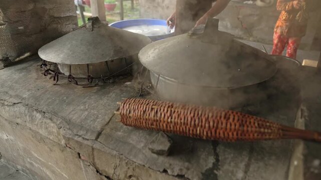 Worker Molds Fragrant Rice Using Tools. Metal And Wicker Tools Precisely Shape Aromatic Steamed Rice. Process Involves Sealing And Molding Fragrant Steamed Rice With Various Tools