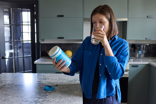 Woman taking her supplements