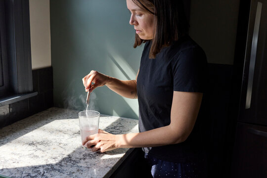 Woman taking her supplements