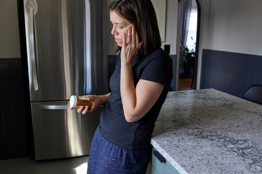 Woman taking her prescription medication