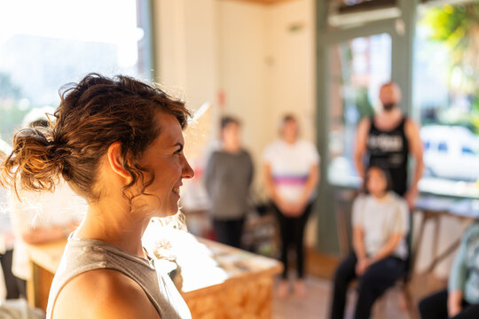 Woman smiling during therapy and relaxation group class