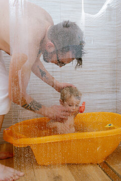 Toddler Enjoys Bath Time in Sao Jorge
