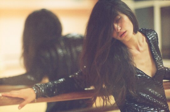 Lo-Fi Photo Of A Girl In A Dance Hall
