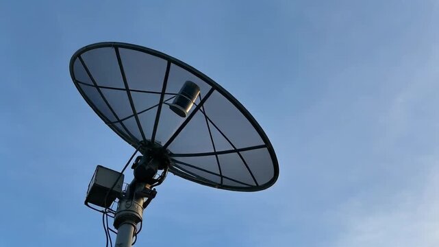 Satellite Dish Antenna Pointing Towards the Sky for Communication. 4k Footage Video