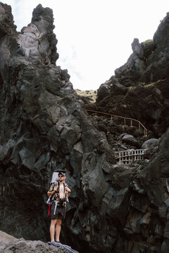 Dad and Son Hike Volcanic Rocks