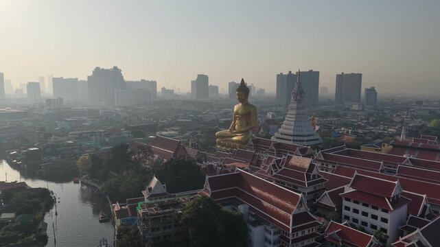 Aerial view of the Giant Golden Buddha in Wat Paknam Phasi Charoen Temple in Phasi Charoen district on Chao Phraya River sightseeing travel Bangkok. Thailand