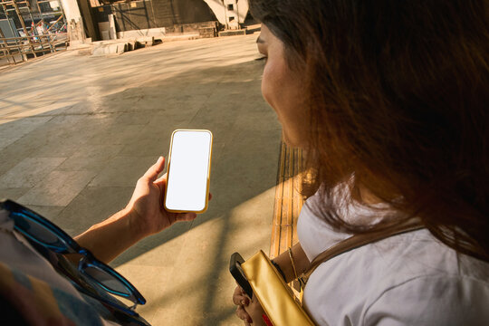 Friends looking for directions in a train station in Mumbai