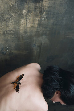 Woman with Butterfly on Her Bare Back