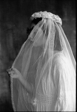Black and white profile portrait of woman with butterfly