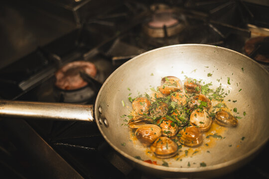 Cooking Clams in Pan on Stove