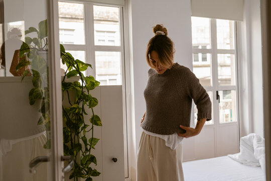 Fitting Sweater in Bedroom