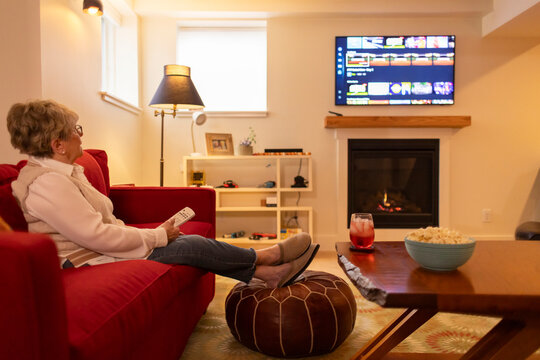 Senior Citizen Streaming tv content at home living room hygge 