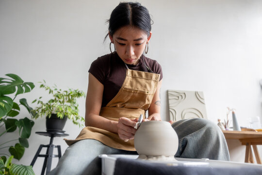 Artisan Crafting Pottery on Pottery Wheel