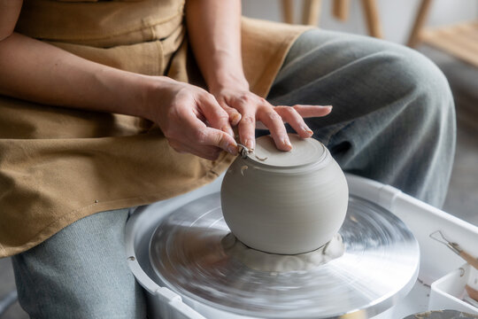 Close-Up of a Potter Shaping a Clay