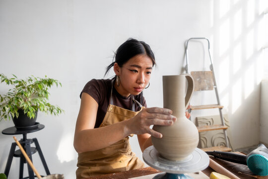 ceramist working a clay jug