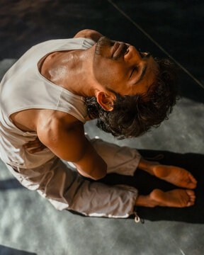 Top View of Seated Backbend Yoga Pose with Closed Eyes
