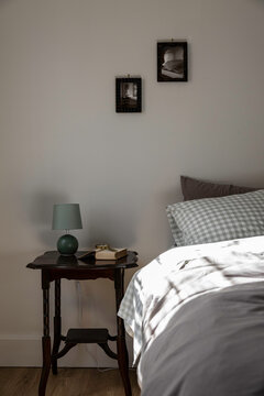 Bedroom vignette of bedside table and bed