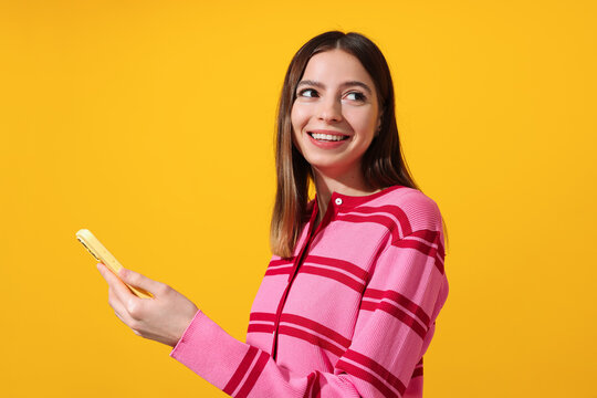 Smiling Woman Holding Yellow Smartphone