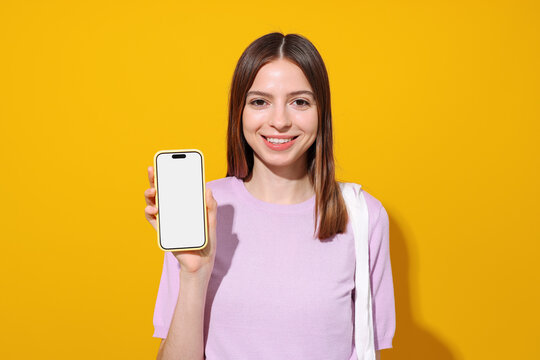 Mockup phone with white screen. Portrait woman on yellow background