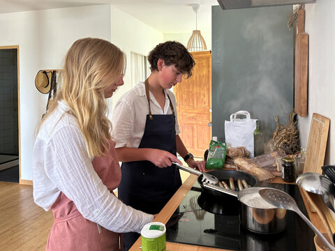 two teens making lunch together