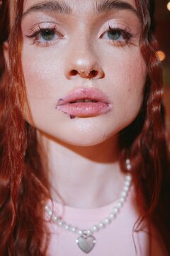 Closeup of woman face with dessert crumbs and smeared lipstick