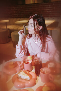 Portrait of woman sit in cafe looking away