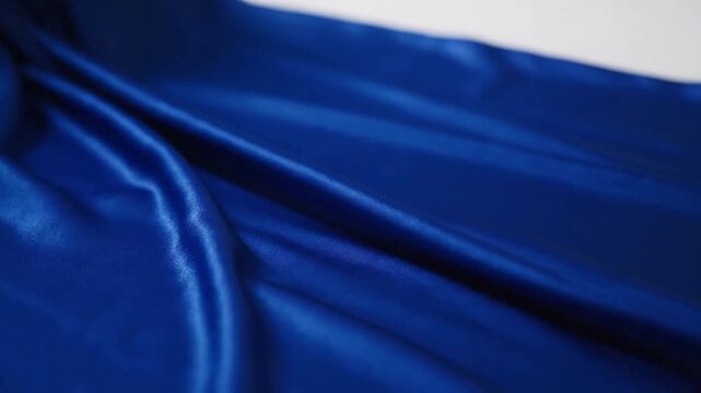 Play of Light and Shadow Explore the dramatic contrast and artistic interplay of light and shadow across the fabric's folds, creating depth and visual interest.