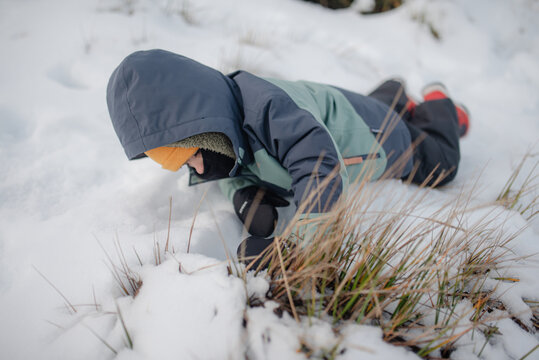 Child playing in the snow