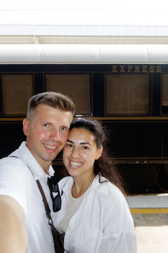 selfie young man and young woman at the train station