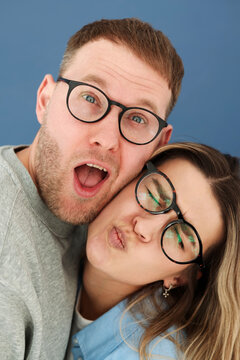 Happy Partners Portrait in a Silly Moment on Blue