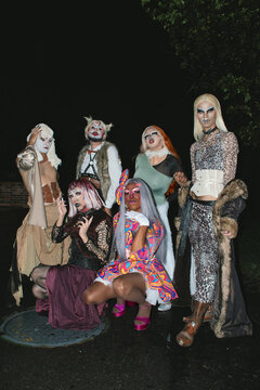 Group of drag queens posing outdoors 