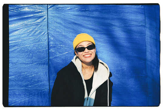 Portrait of a cheerful woman on a blue background 