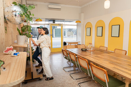 Two people learning and growth in a bright meeting space.