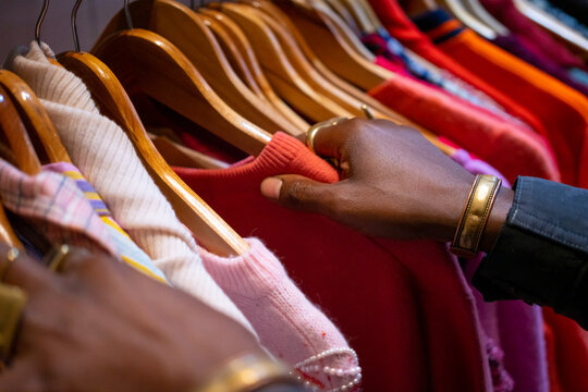 Black man selecting clothes