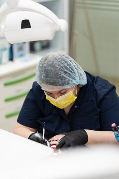 Dentist performing dental procedure on patient
