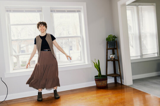 Candid Moment of Young Woman in New Empty Studio Apartment