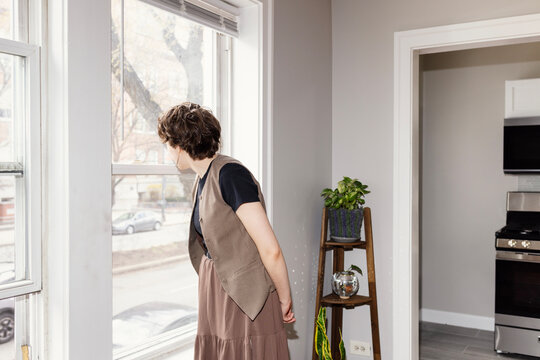 Woman looking out onto Chicago street