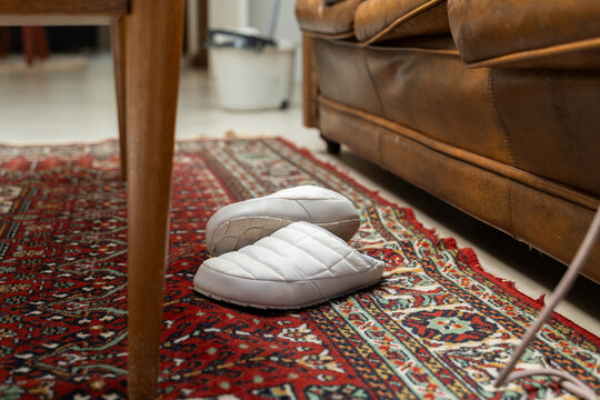 Cozy slippers on carpet