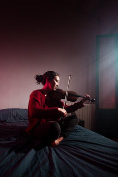Disciplined musician practicing at home