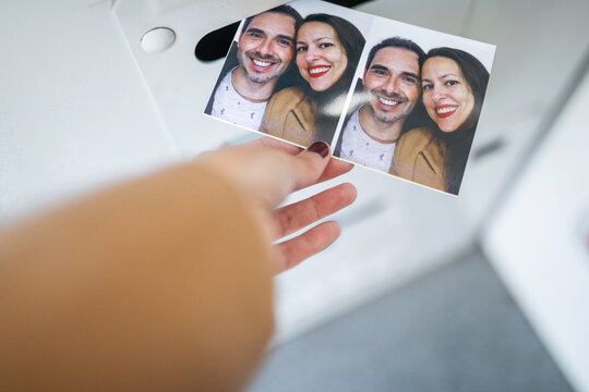 Woman taking photos in photo booth