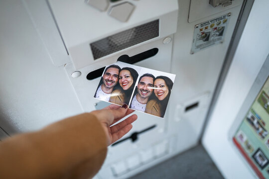 Woman taking photos in photo booth