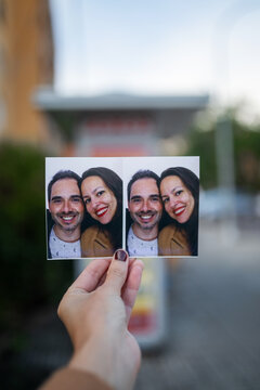 Woman shows photo booth picture