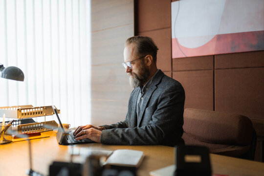 A man uses a tablet in the office