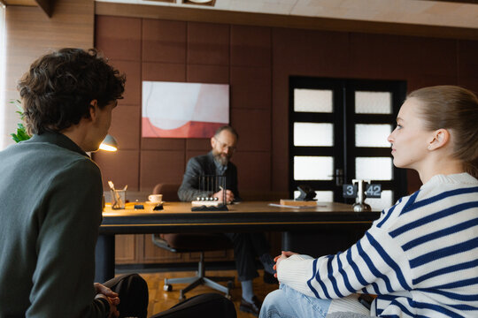 A man receives a visitor in the office