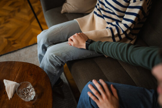 A man and a woman are sitting on a couch